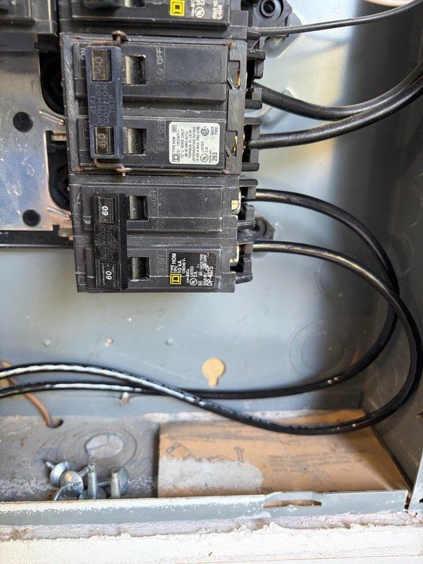 Installed customer-supplied EV charger in garage adjacent to existing 200amp Square D HOM electrical panel. Ran 6 THHN conductors through surface-mounted EMT conduit to junction box and hardwired charger with 60amp fusing for 48amp output capability. Completed programming and setup of charging unit, passed virtual inspection under permit ELE2609-00232, and noted homeowner preference for ChargePoint unit over Electrum charger for potential future consideration.