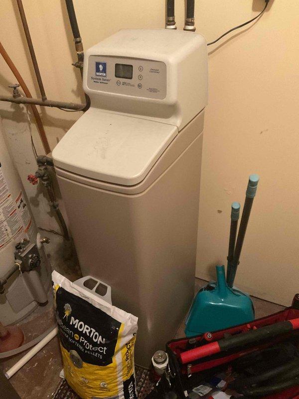 Completed comprehensive plumbing inspection of owner-occupied residential property as part of recurring maintenance service. Inspected and photographed all accessible plumbing systems including GE water heater, water softener system with adequate salt supply, copper supply lines, shut-off valves, and associated connections in utility area. All systems found to be operating properly with no leaks, deficiencies, or immediate concerns identified at time of inspection.