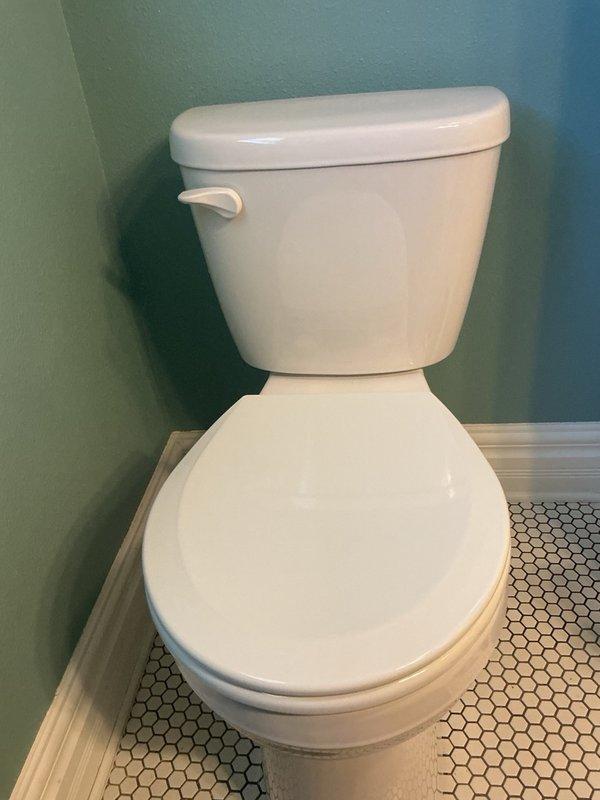Replaced existing 17-year-old toilet with new ADA-compliant round bowl toilet. Installed new shut-off valve and water supply line to ensure proper function and code compliance. Unit tested successfully with no leaks detected.