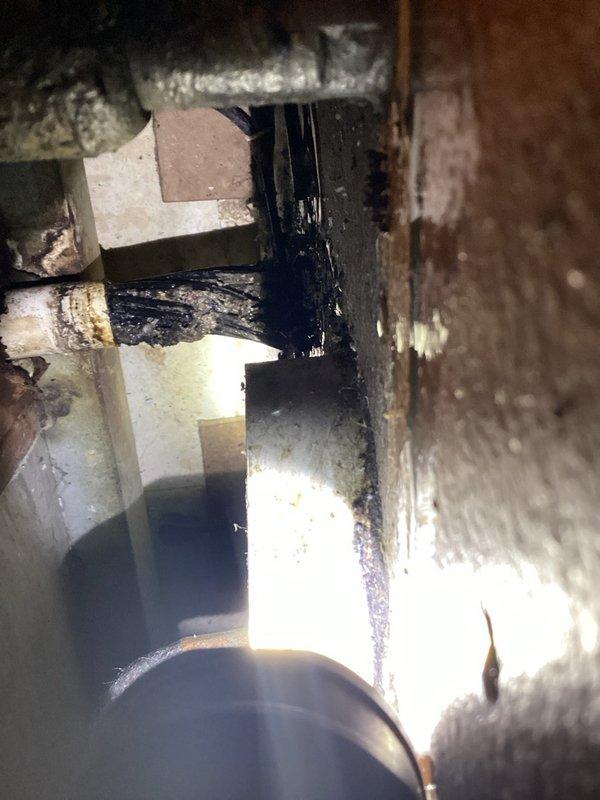 Responded to water leak at commercial mop sink located in rear of building. Upon arrival, identified failed valve at connection point and severely clogged drain filled with straws and debris. Replaced malfunctioning valve with new unit and thoroughly cleaned drain line to restore proper drainage. Tested system for leaks and verified proper operation before completing service.