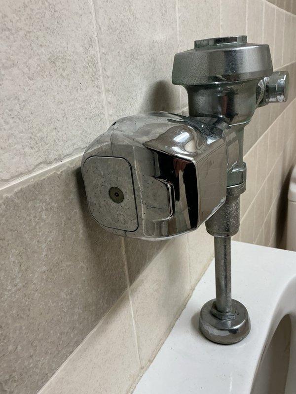 Responded to callback for commercial urinal continuously running water despite previous sensor cleaning. Performed thorough investigation of flush valve assembly and determined sensor cleaning was insufficient to resolve issue. Urinal observed flushing intermittently on its own, indicating internal flush valve failure. Ordered replacement flush valve assembly and temporarily shut off water supply to unit to prevent water waste until new valve can be installed.