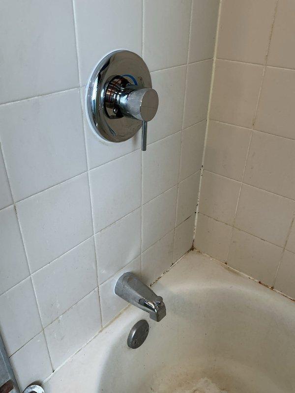 Responded to callback for low water pressure issues in kitchen and shower following recent water heater replacement. Diagnosed calcium buildup and sediment that had broken free from old water heater and lodged in fixture aerators and valve cartridges, restricting flow throughout the system. Replaced kitchen faucet with new unit to restore proper water pressure and functionality. Replaced bathroom shower valve assembly to eliminate restricted flow in the shower. Tested all fixtures after installation to verify adequate water pressure and proper operation throughout the affected areas.