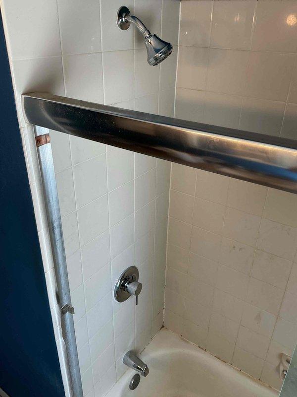 Responded to callback for low water pressure issues in kitchen and shower following recent water heater replacement. Diagnosed calcium buildup and sediment that had broken free from old water heater and lodged in fixture aerators and valve cartridges, restricting flow throughout the system. Replaced kitchen faucet with new unit to restore proper water pressure and functionality. Replaced bathroom shower valve assembly to eliminate restricted flow in the shower. Tested all fixtures after installation to verify adequate water pressure and proper operation throughout the affected areas.