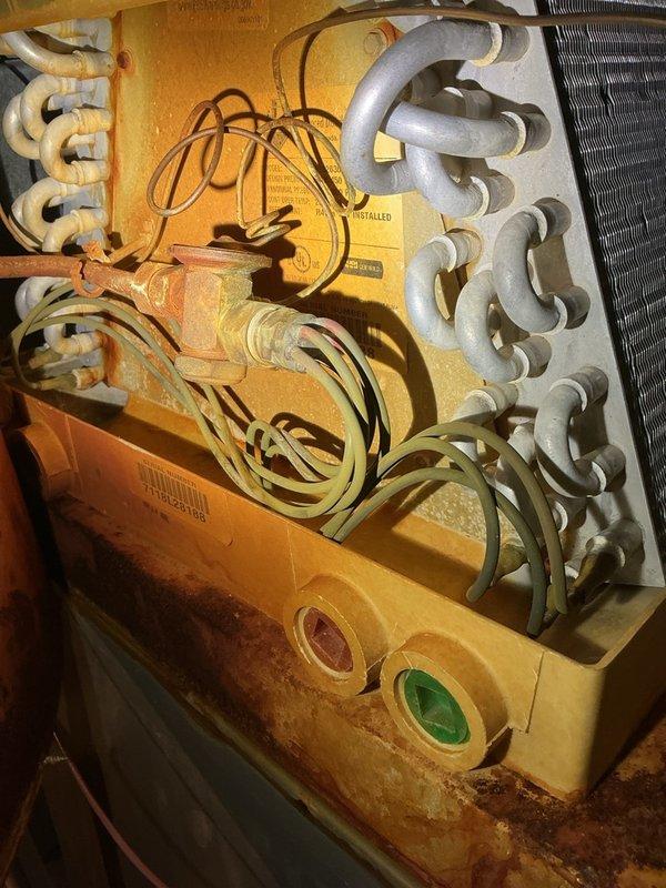 Responded to service call for reported AC evaporator coil leaking causing water damage to flooring on unit installed within the past year. Performed comprehensive system inspection including evaporator coil, drain pan, drain line, refrigerant charge, and outdoor unit—all components found functioning properly with no freeze-up present and proper water flow through drainage system. Identified incorrect air filter size installed (16x25x1 instead of specified 20x25x1). Verified system performance with delta-t reading of 21 degrees, confirming adequate cooling operation. Unable to locate active leak source during inspection as no water leakage was occurring at time of visit. Instructed occupant to contact for immediate return visit if leaking recurs to allow for diagnosis during active failure.