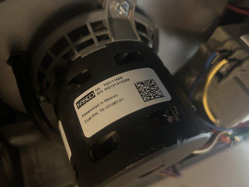 Performed furnace tune-up on 8-year-old 80% efficiency unit located in mechanical closet. Completed standard maintenance including component inspection, gas pressure verification, and air filter check—all operating within normal parameters. Discovered critical safety hazard: inadequate combustion air in mechanical room serving both furnace and natural draft water heater sharing common exhaust. Evidence of backdrafting observed with melted plastic near water heater vent due to insufficient combustion air supply. Unit tagged out per safety protocol due to hazardous operating conditions. Additionally identified failing inducer motor exhibiting excessive noise reported by homeowner from previous season. Documented conditions with photos of motor assembly and system components. Recommended immediate combustion air remediation for mechanical room and inducer motor replacement. Submitted request for pricing on combustion air solution. System remains tagged until safety concerns are addressed 