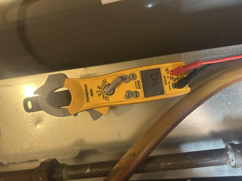 Performed furnace tune-up on 8-year-old 80% efficiency unit located in mechanical closet. Completed standard maintenance including component inspection, gas pressure verification, and air filter check—all operating within normal parameters. Discovered critical safety hazard: inadequate combustion air in mechanical room serving both furnace and natural draft water heater sharing common exhaust. Evidence of backdrafting observed with melted plastic near water heater vent due to insufficient combustion air supply. Unit tagged out per safety protocol due to hazardous operating conditions. Additionally identified failing inducer motor exhibiting excessive noise reported by homeowner from previous season. Documented conditions with photos of motor assembly and system components. Recommended immediate combustion air remediation for mechanical room and inducer motor replacement. Submitted request for pricing on combustion air solution. System remains tagged until safety concerns are addressed 