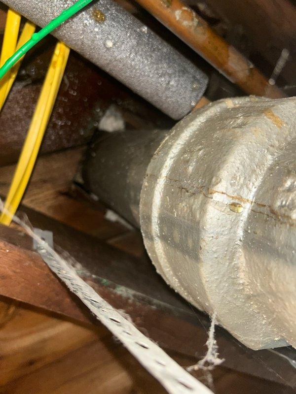 Responded to water leak in basement. Upon arrival, identified active plumbing leak with water still on for the house. Investigated lavatory drain system and determined slow drainage was creating back pressure causing tub overflow. Assessed basement plumbing configuration including water treatment system and vertical pipe assembly. Documented existing conditions with photographs showing utility area layout, sink connections, and mechanical systems. Provided estimate for drain cleaning service to resolve slow drainage issue and prevent future overflow problems.