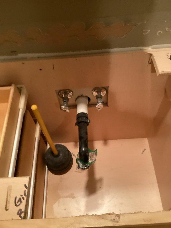 Responded to water leak service call requiring replacement of shut-off valves for multiple sink installations. Assessed plumbing connections for five sinks total, including three new sink installations and two existing fixtures in bathrooms and kitchen areas. Documented existing conditions through photography, revealing corroded supply valves and signs of water damage beneath bathroom vanity. Replaced defective shut-off valves with new chrome angle stops to restore proper water supply control. Installed new supply valves at all fixture locations to accommodate new sink hookups and ensure leak-free operation. Tested all connections for proper function and water flow restoration upon completion.