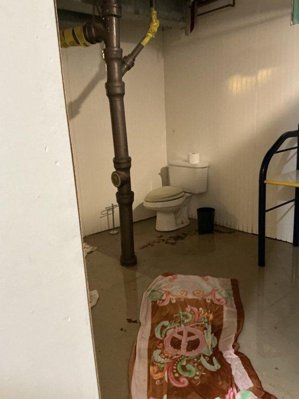Responded to emergency call for water throughout basement with unknown source. Upon inspection, determined the issue was a backed-up sewer main rather than a supply line leak. Dispatched specialized drain cleaning equipment to clear the main sewer blockage and restore proper drainage to the property.