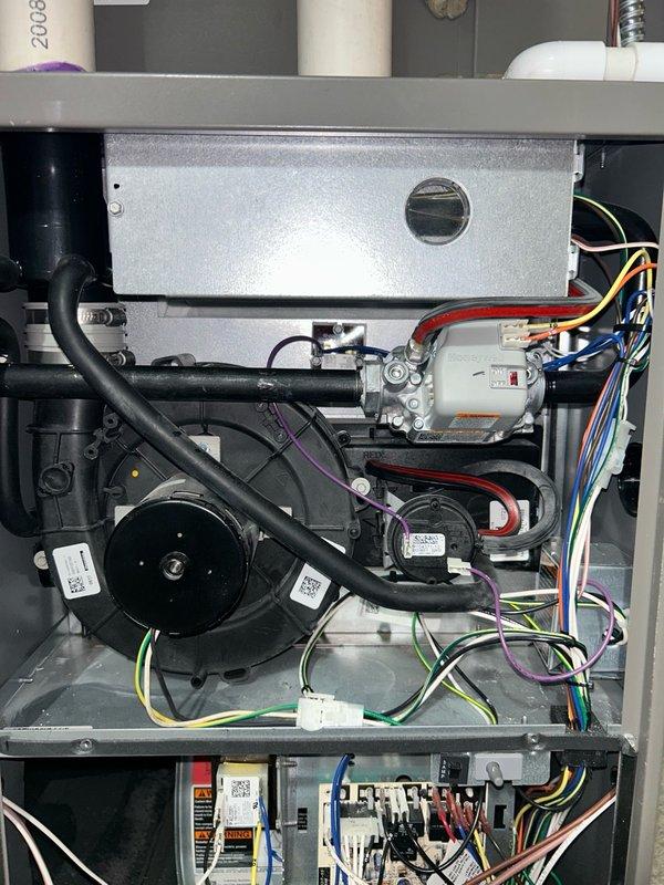 Performed comprehensive furnace tune-up inspection per maintenance agreement protocol. Verified thermostat operation showing proper temperature control at 73°F setpoint with Honeywell ProSeries digital unit functioning correctly. Inspected blower motor assembly, burner and heat exchanger compartment, inducer operation, ignition system, flame sensor, safety controls, electrical connections, and condensate drain system. Evaluated air filter condition and measured temperature rise across heat exchanger. All operational parameters and safety readings within manufacturer specifications with no mechanical deficiencies identified. System operating properly with all components functioning as designed.