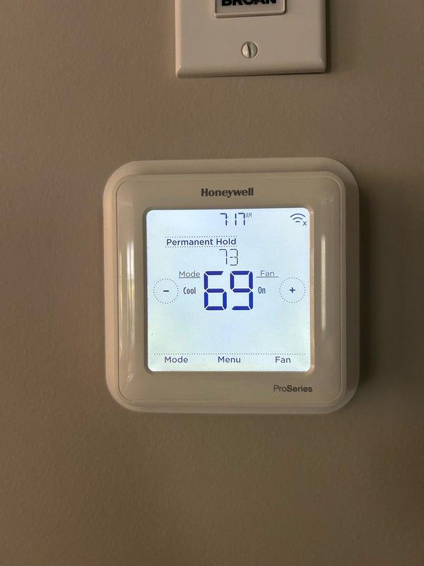 Performed comprehensive furnace tune-up inspection per maintenance agreement protocol. Verified thermostat operation showing proper temperature control at 73°F setpoint with Honeywell ProSeries digital unit functioning correctly. Inspected blower motor assembly, burner and heat exchanger compartment, inducer operation, ignition system, flame sensor, safety controls, electrical connections, and condensate drain system. Evaluated air filter condition and measured temperature rise across heat exchanger. All operational parameters and safety readings within manufacturer specifications with no mechanical deficiencies identified. System operating properly with all components functioning as designed.