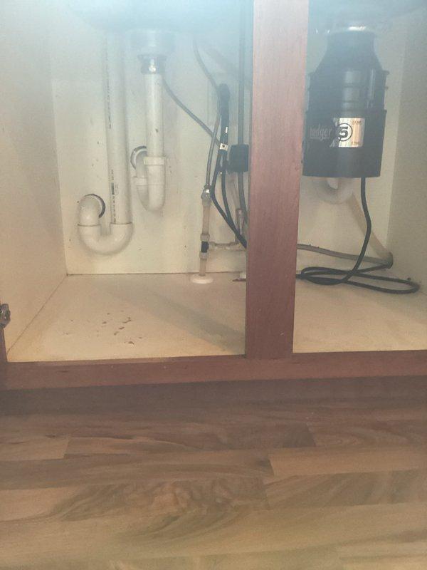 Responded to kitchen sink backup occurring during dishwasher operation. Upon inspection, identified clogged drain line caused by accumulated food debris in the system. Cabled the drain line to clear the obstruction and restore proper drainage flow. Verified garbage disposal and P-trap connections were secure and functioning correctly. Tested system by running water through sink and dishwasher cycle to confirm complete clearance and proper drainage with no backup issues.