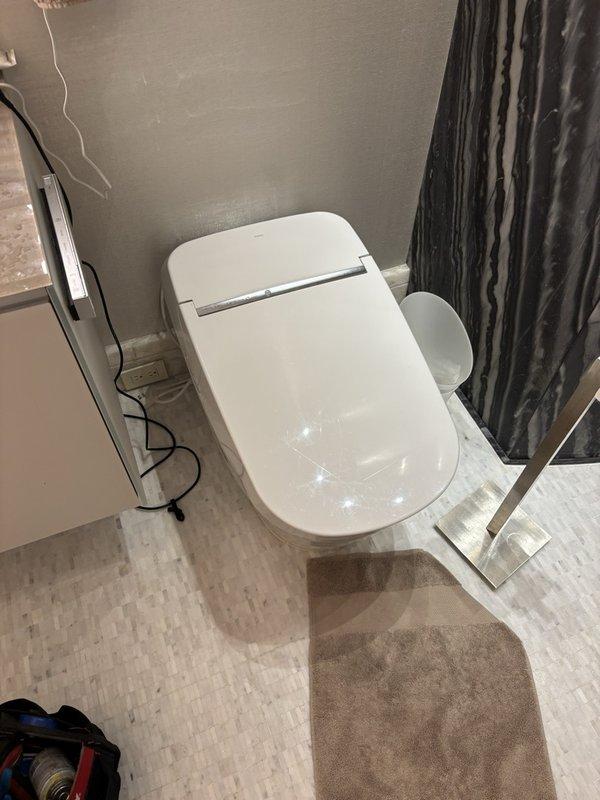 Restored full operation to Toto Neorest toilet in primary bathroom by replacing manufacturer-supplied components including wand assembly, multifunction unit, and deodorizer. Tested all functions post-installation to verify proper operation of bidet features, flush mechanisms, and deodorizing system. Upon inspection of secondary hallway bathroom Neorest unit, identified wand retraction malfunction and coordinated with Toto for replacement parts to restore that unit to proper working condition. Primary bathroom Neorest left in full service with all functions operating normally. One-year parts and labor warranty included on completed repair.
