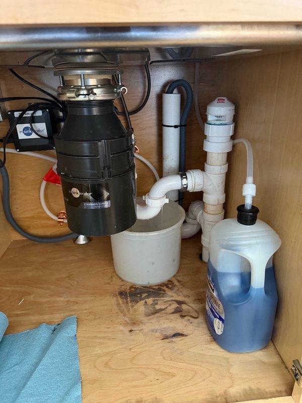 Responded to kitchen sink drain stoppage caused by lemon peel lodged in garbage disposal system. Customer had attempted multiple clearing methods without success. Utilized drain auger to successfully clear obstruction from kitchen sink drain line. Verified proper drainage and water flow upon completion. Plumbing system restored to normal operation.