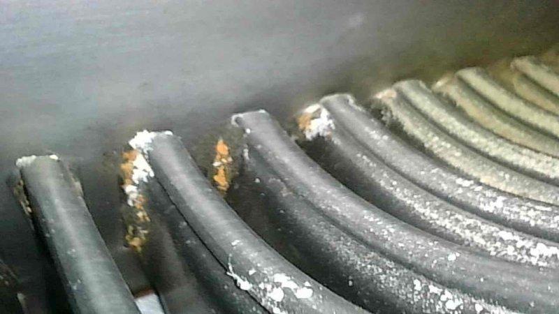 Responded to no cooling call on system over 10 years old displaying Code 72 thermal cut-off lockout. Upon inspection, found outdoor condenser coil completely blocked with debris and contamination. Thoroughly cleaned and rinsed condenser coil to restore proper airflow. After cleaning, attempted system startup and discovered compressor exhibiting excessive vibration and internal metal rattling noises indicating mechanical failure. Verified refrigerant charge was within acceptable range, confirming compressor internal component failure as root cause of thermal lockout and loss of cooling capacity. 

Performed courtesy inspection of indoor furnace unit and identified questionable areas on heat exchanger showing signs of potential deterioration. Advised homeowner of heat exchanger condition and recommended monitoring throughout remaining heating season with annual inspection. Documented findings with photographic evidence showing condenser unit exterior condition and contaminated coil surfa