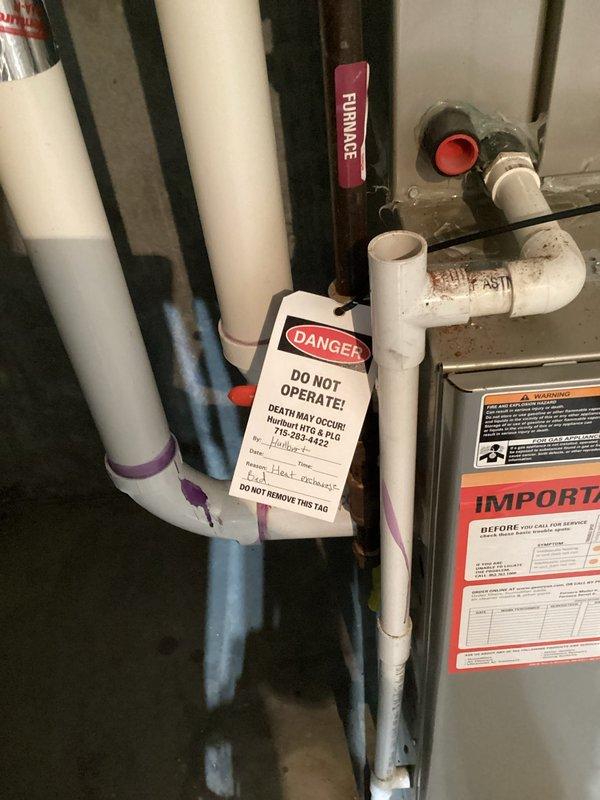Performed comprehensive maintenance tune-up on 15-year-old Carrier furnace to evaluate safety, efficiency, and operational reliability. Conducted thorough visual inspection of heat exchanger and critical system components as part of standard diagnostic procedures. Identified compromised heat exchanger presenting significant safety hazard requiring immediate system shutdown. Documented findings with detailed photographs showing heat exchanger damage and applied red "DANGER - DO NOT OPERATE" lockout tag to prevent system use until repairs completed. Unit rendered non-operational due to safety concerns. Scheduled follow-up appointment for furnace replacement estimate and heat exchanger pricing options.