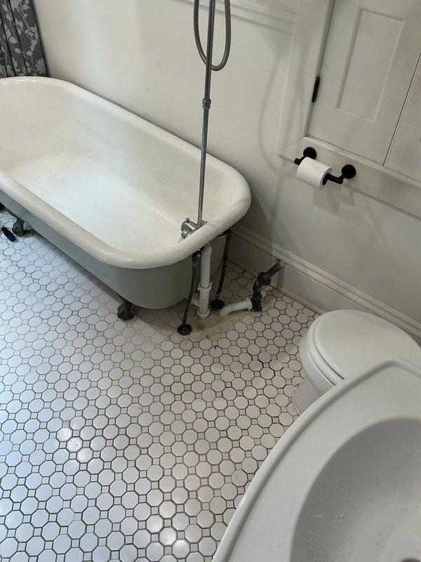 Responded to a tub backup issue where previous cabling attempts were unsuccessful. Removed the tub overflow plate and cabled the drain line to 15 feet, extracting a substantial hairball obstruction that was blocking proper drainage. Restored full flow to the tub drain and performed operational testing by running water to verify complete resolution and proper drainage function.