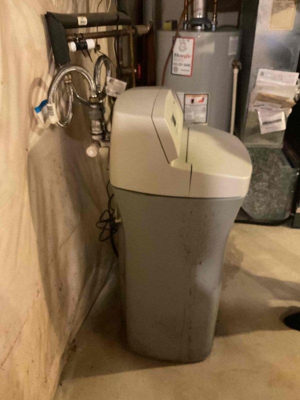 Responded to service call for leaky faucet in wash tub and outside spigot locked in closed position. Performed diagnostic inspection of both fixtures and assessed water softener system condition. Documented equipment conditions with photographs and provided detailed repair quotations for necessary plumbing corrections.