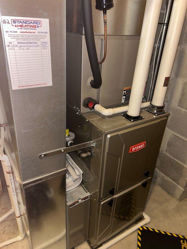 Completed comprehensive furnace tune-up and maintenance inspection on Bryant gas furnace system. Performed thorough evaluation of all critical components including thermostat operation, air filter condition, blower assembly, burner and heat exchanger compartment, inducer motor operation, ignition system, flame sensor, safety controls, electrical connections, condensate drain system, and temperature rise across heat exchanger. All operational readings measured within manufacturer specifications with no mechanical deficiencies or safety concerns identified. System verified to be operating properly and efficiently. Advised customer to maintain regular air filter replacement schedule to ensure continued optimal performance.