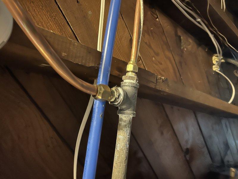 Responded to gas line repair service call at residential property. Upon inspection of the attic-mounted furnace system, identified a faulty gas line fitting requiring replacement. Successfully replaced the compromised brass fitting connecting the gas supply line to the furnace, ensuring proper threading and secure connections. Verified system integrity and tested for gas leaks following repair completion.
