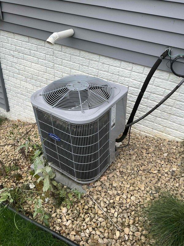 Completed comprehensive HVAC maintenance agreement service including outdoor condensing unit and indoor furnace inspection. Tested all electrical components on outdoor unit, which were found to be within specifications. Rinsed down outdoor condenser coil due to accumulated dirt and debris. Observed outdoor unit was not level, with gravel base eroding and causing unit to tilt to one side; attempted to re-level unit and advised homeowner to install larger rocks or re-establish proper base to prevent further settling and potential equipment damage on sloped terrain.

Performed indoor furnace inspection including heat exchanger evaluation, which showed no signs of cracking or deterioration. Tested all electrical components, confirming proper operation and readings within manufacturer specifications. Cleaned flame sensor to ensure reliable ignition. Flushed condensate trap to maintain proper drainage. Started furnace and verified proper heating operation with 50-degree temperature rise acro