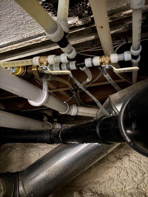 Responded to complaint of inadequate hot water supply to bathtub in home with dual water heater system consisting of 6-8 year old tanked natural gas unit connected to 3-4 year old tankless natural gas unit. Diagnosed faulty mixing valve on primary bathroom bathtub as cause of hot water loss. Replaced defective mixing valve with 3/4" lead-free thermostatic mixing valve. Tested installation for proper operation and leaks, confirming sustained hot water delivery for 5-10 minutes of continuous flow. Left system in full operational service with no issues detected.