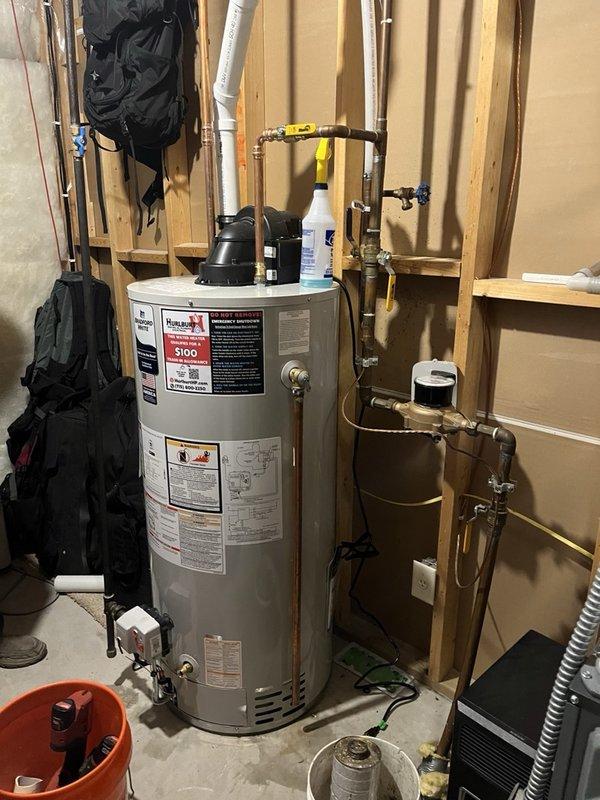 Responded to no hot water call and found 20-year-old water heater had been disassembled by homeowner in attempted repair. Removed failed unit and installed new 50-gallon natural gas power vent water heater with proper copper piping connections, pressure relief valve, and shut-off valves. Tested system for proper operation and verified hot water delivery throughout residence.