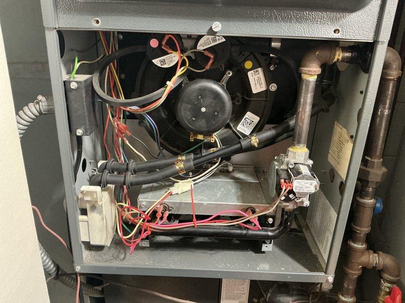Responded to no heat call on 10-year-old furnace with intermittent heating issues. Upon diagnostic inspection, found multiple critical component failures including failing flame sensor and ignitor, inducer draft motor drawing high amperage, and suspected exhaust leak in secondary heat exchanger that could not be fully confirmed due to access limitations. Unit was operational at time of arrival but exhibited unreliable performance. Due to age of equipment and extent of multiple simultaneous failures requiring costly repairs, recommended full system replacement. Documented conditions with photos and scheduled replacement estimate appointment.