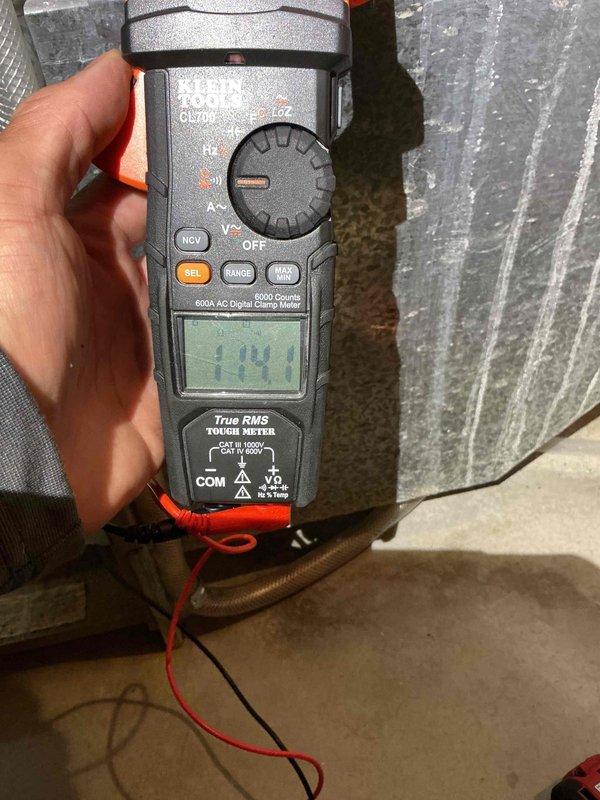 Completed annual heating maintenance tune-up on a 25-year-old Goodman furnace. Performed comprehensive inspection revealing several age-related concerns including rust staining in lower right inducer chamber, elevated inducer motor amp draw, rust on heat exchangers (no cracks detected), and high resistance reading on hot surface ignitor at 114.1 ohms. Cleaned flame sensor by reaching through burner assembly as sensor was seized and could not be removed. Tested blower motor capacitor reading 9.2µF on 10µF rated unit. Cleared condensate drain line by blowing compressed air through system. Documented all findings with photos and provided replacement estimates for aging components; homeowner elected to decline repairs at this time and continue monitoring system performance.