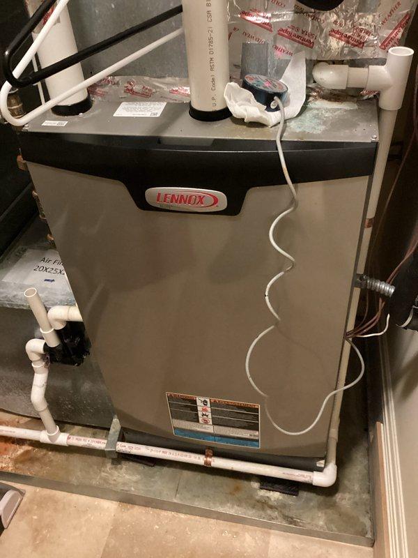 Responded to callback for inadequate cooling upstairs with unit running continuously without reaching setpoint. Found evaporator coil completely frozen over due to insufficient airflow. Vacuumed water from system, dried safety switch, and installed temperature sensor. Recommended installation team perform ductwork modifications to increase airflow across coil and prevent future freeze-ups.
