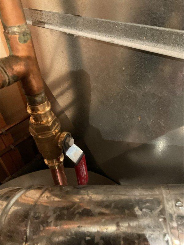 Responded to callback for code correction involving gas and water shut-off valves that were not closing completely due to interference from adjacent vent piping. Adjusted vent pipe positioning to establish proper clearances, allowing both valves to achieve full shut-off capability and meet safety code requirements. Documented corrected installation with photographs showing proper valve operation and adequate spacing between components.