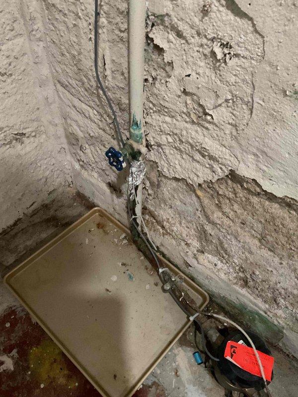Responded to a severe water leak at the main water intake valve. Upon arrival, found the existing valve actively leaking, causing water accumulation and significant moisture damage to the surrounding basement walls. Placed containment pan and pump to manage water during repair. Shut off the main water supply, removed the failed valve, and installed a new replacement valve with proper fittings. Tested the new installation for leaks and verified proper operation. Restored water service to the property upon completion of the repair.