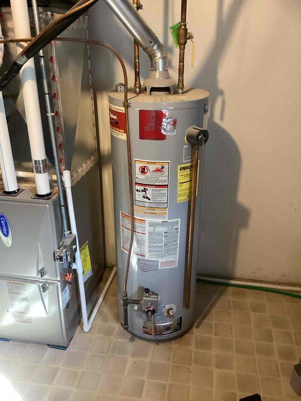 Responded to no hot water call for 38-gallon natural gas water heater approximately 20 years old. Found pilot light extinguished, preventing unit from heating water. Successfully relit pilot light and restored hot water service to residence.