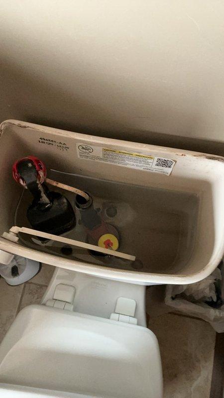 Conducted comprehensive plumbing inspection to investigate reported water leak with unknown source. Inspected toilet tank components including flapper valve, fill valve assembly, and float mechanism, finding all components functional with no visible leaks detected. Examined bathroom plumbing fixtures including shower/tub area and associated hardware, with no active water leakage identified at time of inspection.