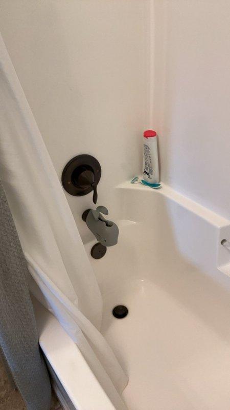 Conducted comprehensive plumbing inspection to investigate reported water leak with unknown source. Inspected toilet tank components including flapper valve, fill valve assembly, and float mechanism, finding all components functional with no visible leaks detected. Examined bathroom plumbing fixtures including shower/tub area and associated hardware, with no active water leakage identified at time of inspection.