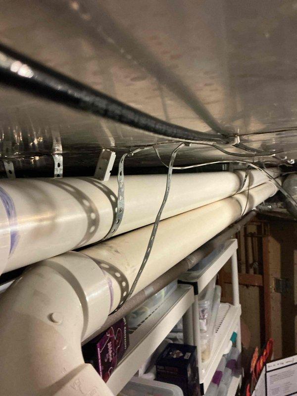 Responded to callback for water heater venting issue following previous service visits where water was accumulating in the vent pipe due to improper pitch. Drained water from vent line and re-pitched the PVC venting system to ensure proper drainage and prevent future water buildup. System now functioning correctly with adequate slope for condensate drainage.