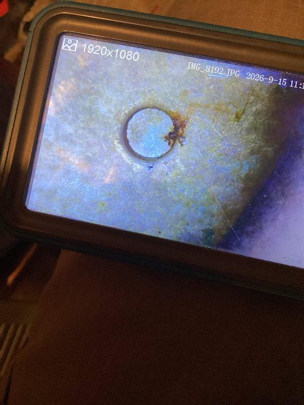 Performed municipal HVAC inspection on residential furnace system. Unit currently operational, however visual inspection revealed significant deterioration of the heat exchanger with visible corrosion and surface degradation. Documentation completed with photographic evidence of compromised heat exchanger condition and recommendation provided to property owner for immediate attention due to potential safety concerns.