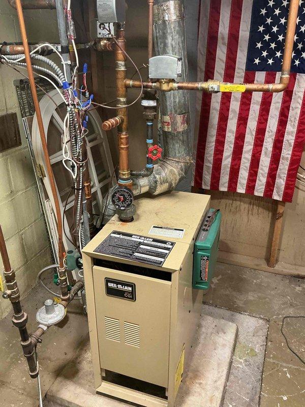 Responded to heating system malfunction with continuous boiler operation and non-responsive thermostats across all zones. Diagnosed stuck end switch preventing proper system shutdown and identified incompatible Nest thermostat causing Taco zone control board to malfunction and display error codes. Removed problematic Nest unit and installed compatible replacement thermostat to restore proper zone control communication. Verified all zone circuits functioning correctly, confirmed proper boiler cycling, and tested thermostat calls across all five zones to ensure system responded appropriately to heat demand.