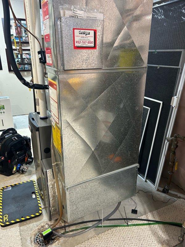 Completed comprehensive furnace tune-up on 10-year-old unit, performing full system inspection including thermostat operation, air filter condition, blower assembly, burner/heat exchanger compartment, inducer operation, ignition system, flame sensor, safety controls, electrical components, condensate drain, and temperature rise verification. Cleaned flame sensor, cleared condensate drain line of blockage, removed debris from burner compartment, and cleared both pressure tube and condensate tube to ensure proper drainage and system operation. All operational readings confirmed within normal parameters with no mechanical deficiencies or safety concerns identified; system verified operating properly and ready for heating season.