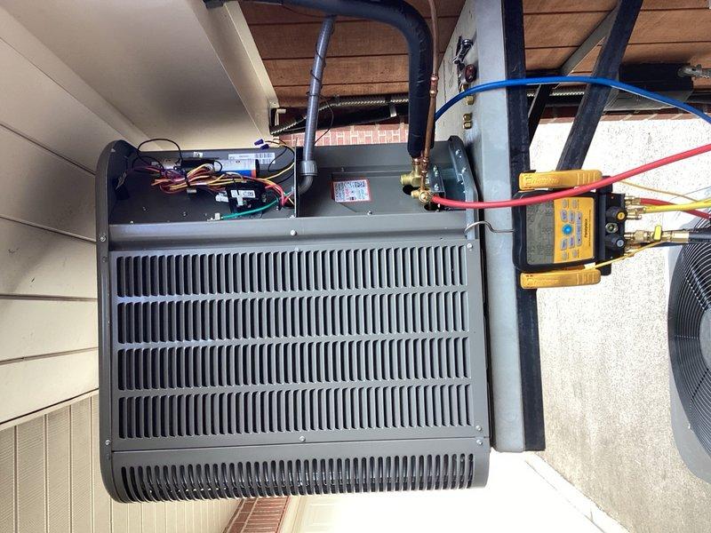 Responded to warranty call for refrigerant leak on recently replaced condensing unit. Recovered refrigerant from system and performed comprehensive pressure testing at 600 PSI with nitrogen for one hour with zero pressure drop, confirming no leaks in condenser coil or primary refrigerant circuit. Suspect leak originating from location other than outdoor unit based on testing results. Pressurized system to maximum capacity with available nitrogen supply and injected UV dye into refrigerant circuit to facilitate leak detection during extended runtime. Disconnected electrical power at breaker and disconnect switch per safety protocol, leaving system pressurized for leak identification. System requires substantial operating hours for UV dye to circulate and pinpoint leak location during follow-up inspection.