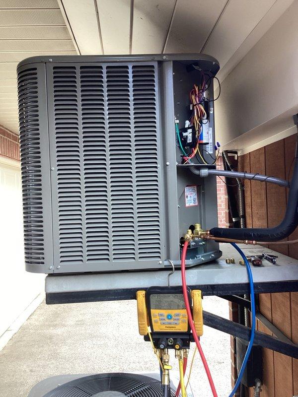 Responded to warranty call for refrigerant leak on recently replaced condensing unit. Recovered refrigerant from system and performed comprehensive pressure testing at 600 PSI with nitrogen for one hour with zero pressure drop, confirming no leaks in condenser coil or primary refrigerant circuit. Suspect leak originating from location other than outdoor unit based on testing results. Pressurized system to maximum capacity with available nitrogen supply and injected UV dye into refrigerant circuit to facilitate leak detection during extended runtime. Disconnected electrical power at breaker and disconnect switch per safety protocol, leaving system pressurized for leak identification. System requires substantial operating hours for UV dye to circulate and pinpoint leak location during follow-up inspection.