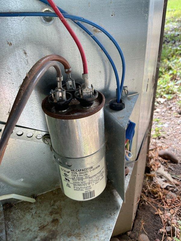 Performed comprehensive HVAC maintenance inspection on 2005 York R-22 air conditioning system and furnace. Discovered severe evaporator coil airflow restriction with approximately 80% blockage, damaged suction line, and refrigerant circuit restriction causing abnormal suction and head pressures. Identified active gas leak at furnace burner orifice and manifold area requiring immediate shutdown for safety. Documented extensive cobweb and debris accumulation in outdoor unit electrical compartment, corroded drain pan and cabinet areas with potential leakage, and aging capacitor with rust on terminal cap. Captured detailed photographs of equipment make, model, and serial numbers as requested, along with electrical components and system condition. Recommended complete system replacement due to equipment age (20 years), obsolete R-22 refrigerant, severely compromised evaporator coil, cabinet corrosion, and critical gas safety concern. Coordinated with homeowners to schedule consultation with