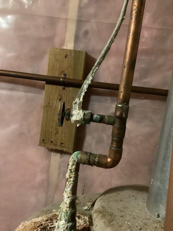 Responded to no heat call on 21-year-old LP furnace. Upon arrival, found unit non-operational with pilot light unable to ignite. Conducted thorough diagnostic inspection of furnace and surrounding basement area. Discovered significant water accumulation in basement due to drain backup, potentially related to water heater condition. Inspected furnace components and identified seized inducer motor as root cause of heating failure. Manually rotated inducer motor shaft, which temporarily freed the motor and allowed it to activate, confirming electrical functionality. However, motor exhibited severe mechanical degradation and binding consistent with age and wear. Given the critical role of the inducer motor in establishing proper draft and combustion airflow, determined that replacement is necessary for reliable winter operation. Assessed overall furnace condition and noted general deterioration consistent with 21 years of service life. Documented findings with photographic evidence showing