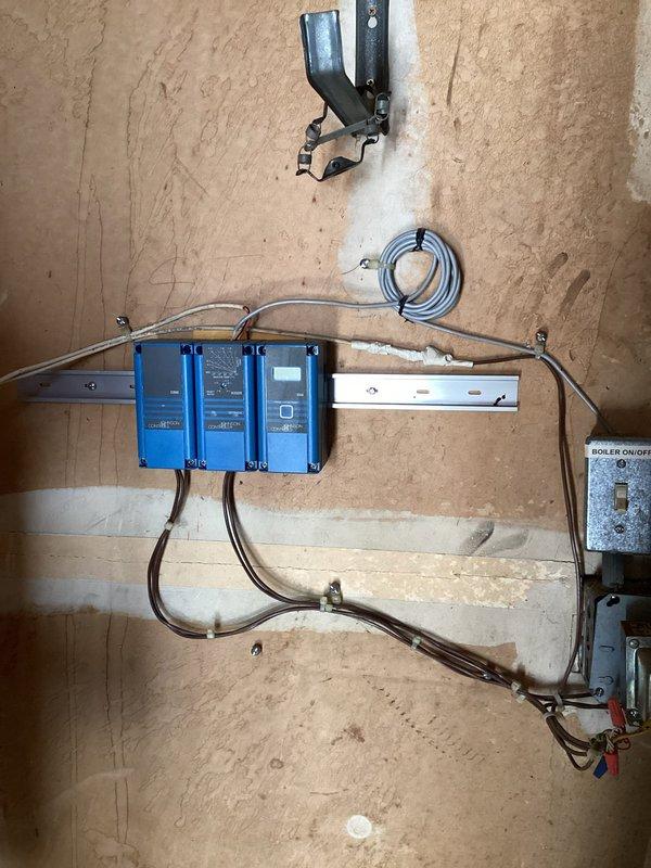 Responded to water leak complaint at multi-unit property with shared boiler system serving six condos. Inspected baseboard heating system and identified active water leak at baseboard heater unit in front room. Documented conditions with photos showing aged finned heat exchanger components and boiler control panel with on/off switch. Customer declined to have shared boiler system activated at this time. Provided parts estimate for repair, noting that boiler equipment is HOA-owned and serves multiple units requiring coordination with property management for resolution.