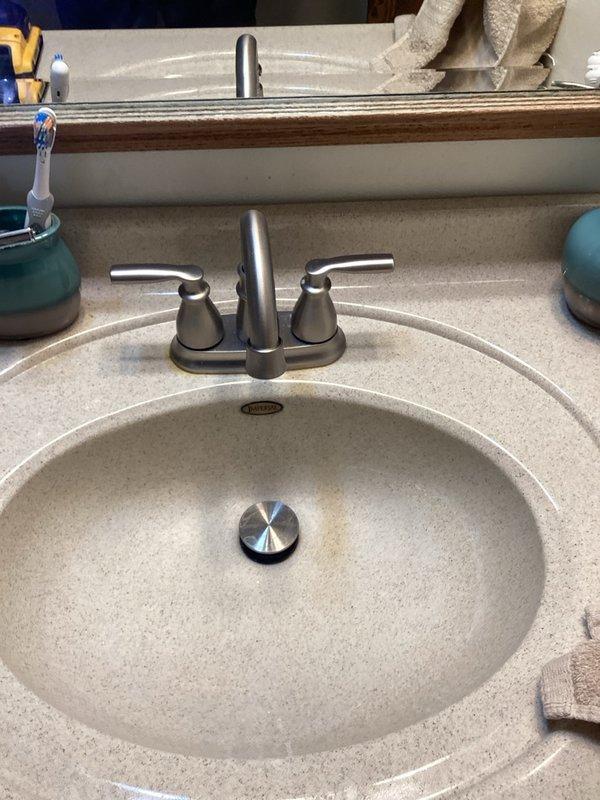 Completed family rewards plumbing inspection at residential property. Removed and replaced aging 1991 model 40-gallon power vent water heater that had reached end of service life. Installed new power vent water heater unit, ensuring proper venting connections and code compliance. Inspected bathroom plumbing fixtures including tub/shower assembly with chrome single-handle faucet, diverter valve, and vanity sink with two-handle centerset faucet in brushed nickel finish. All fixtures found in functional condition with normal wear. Documented installation with photos for service records.