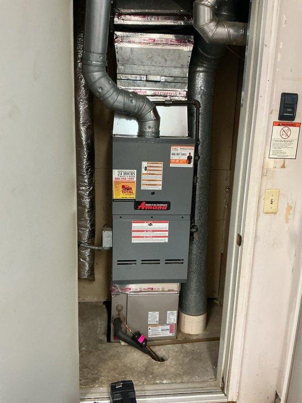 Performed scheduled maintenance on a 17-year-old Amana furnace, which included changing the air filter, scrubbing burners and flame sensor, and inspecting wiring and pressure switch—all components found in acceptable condition. During heat exchanger inspection, discovered multiple holes compromising system integrity. Conducted safety testing revealing CO levels at 14 ppm and gas pressure at 3.16", both within acceptable ranges. Due to compromised heat exchanger, red-tagged the unit for safety, shut off gas line and gas valve to the furnace, and coordinated scheduling for replacement system estimate. Customer requested simple thermostat replacement but opted to handle installation independently.