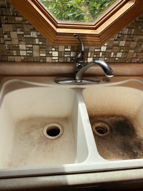 Installed customer-supplied double-basin kitchen sink in existing countertop opening. Connected plumbing fixtures including drain assemblies, P-traps, and supply lines to existing water connections. Verified proper drainage, tested for leaks, and ensured all connections were secure and functioning correctly upon completion.
