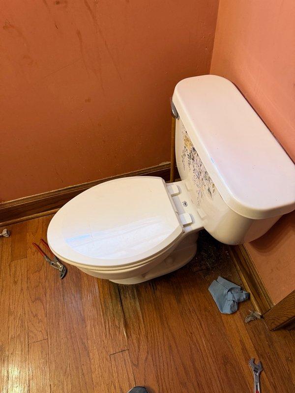 Responded to service call for leaking toilets at residential property. Downstairs toilet was pulled and reset to address leak at base. Upstairs toilet inspection revealed compromised flange falling through deteriorated subfloor, requiring future floor replacement. Successfully pulled and reset upstairs toilet to restore proper function and seal.