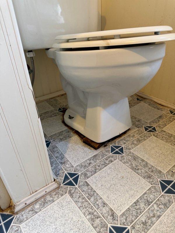 Responded to service call for leaking toilets at residential property. Downstairs toilet was pulled and reset to address leak at base. Upstairs toilet inspection revealed compromised flange falling through deteriorated subfloor, requiring future floor replacement. Successfully pulled and reset upstairs toilet to restore proper function and seal.