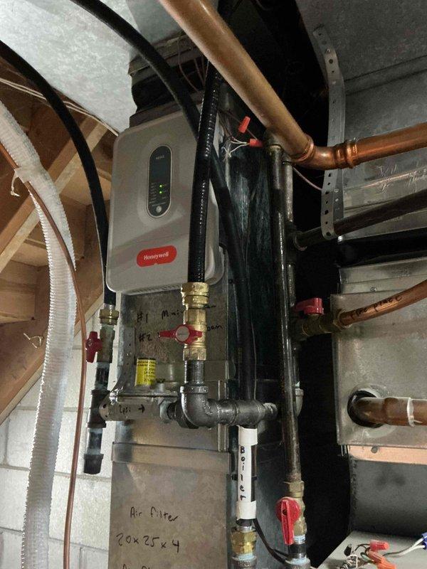 Installed flexible gas line up to 10 feet with two fittings to supply new stove location. Drilled access point through kitchen floor at appliance alcove and installed gas-tight floor bracket with fitting. Accessed basement area below and tapped into existing gas supply line, running new branch line vertically through floor to terminate at kitchen level. Secured all connections with proper fittings and brackets. Pressurized the gas system and performed leak detection testing on all new joints and fittings—no leaks detected. System passed pressure test successfully. Shut off gas supply at isolation valve and capped the terminal end of the new gas line. Installation is ready for appliance connection by stove installer, who will remove cap and complete final hookup to appliance.